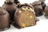 Healthy gourmet HNINA Organic Raw Dark Chocolate Boulders and Rocks sprouted Pecans and sprouted Pine Nuts truffles.